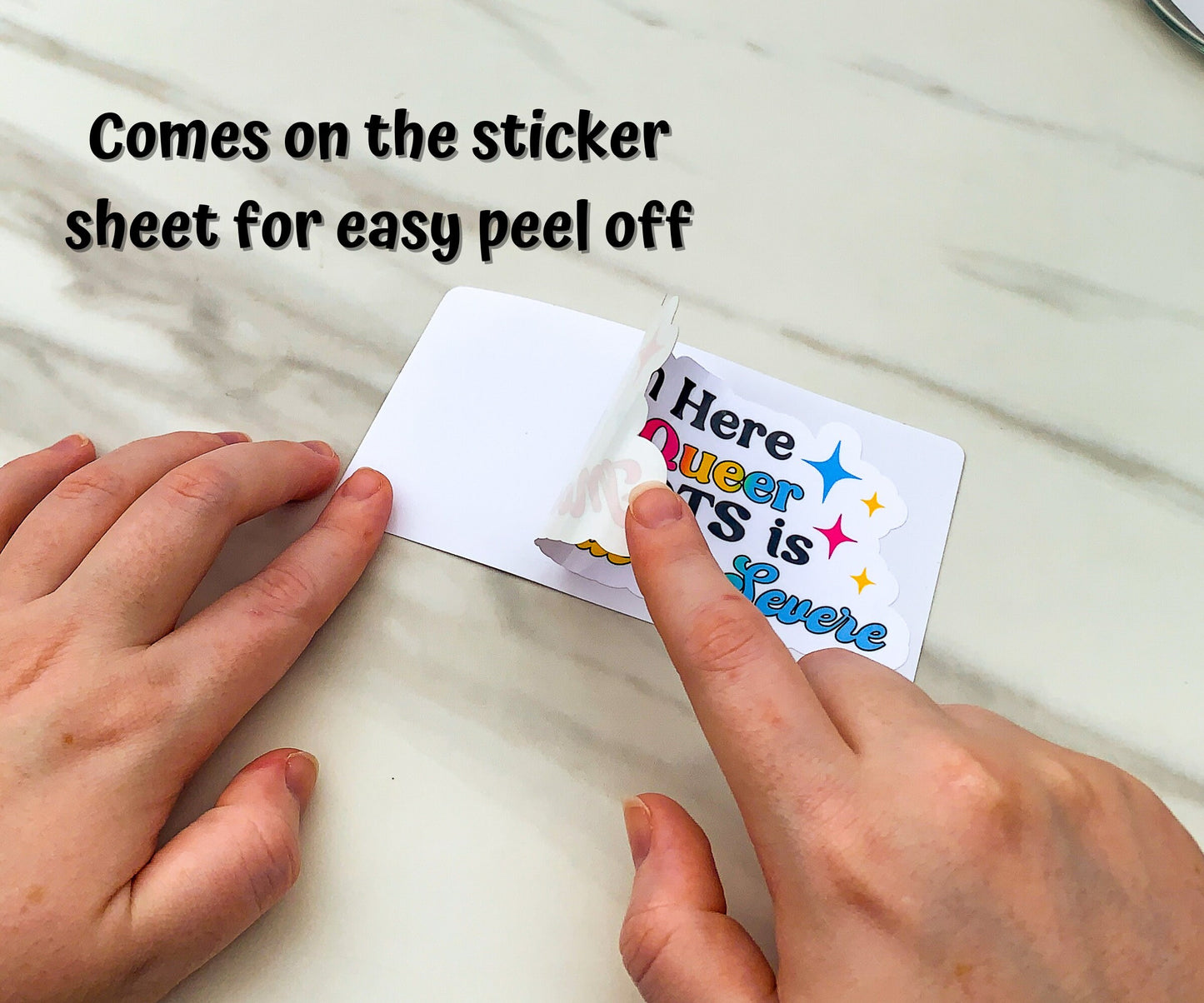 One of the stickers is shown being peeled off a sticker sheet with extra space around it. A note says that it comes on the sticker sheet for easy peel off.