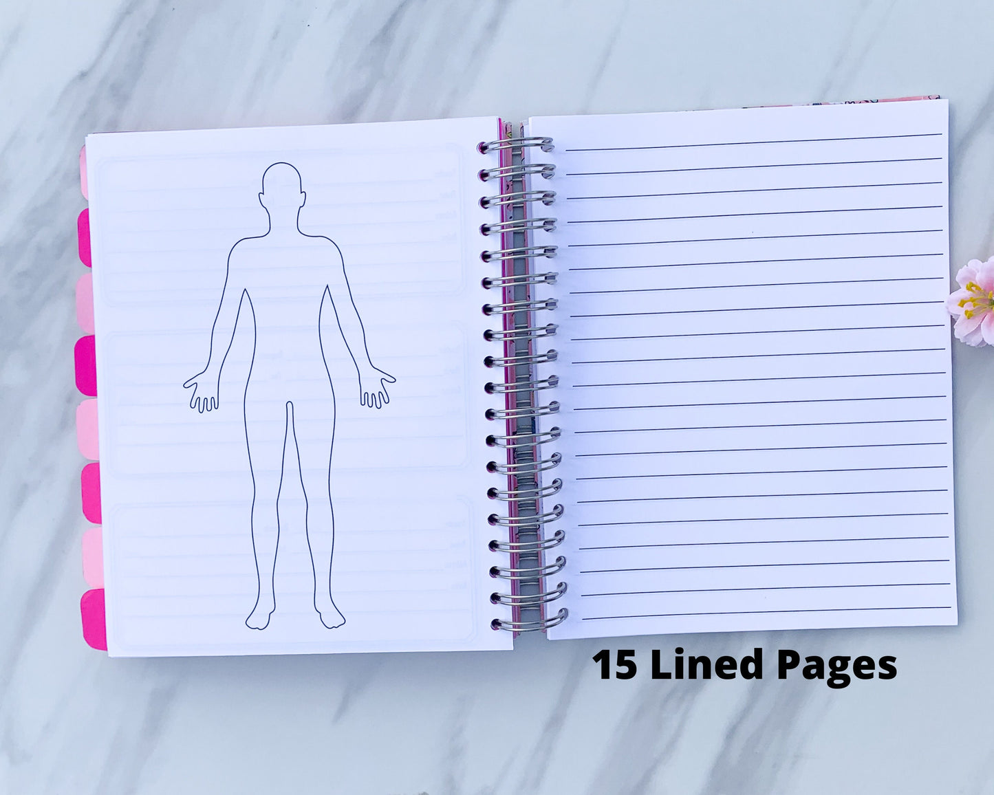 The spiral book is open to show a large body outline on the left page and a lined page on the right. A note below the lined page says 15 Lined pages.