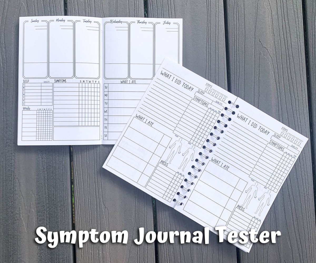 Both tester are shown open on grey wood planks. On the upper left is the hardcover style and the bottom right is the spiral style. Words say Symptom Journal Tester.