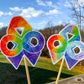 The word cloud and watercolor designs are shown on 2 sticks. Both ribbons feature an rainbow gradient awareness ribbon with a rainbow gradient infinity in the center. The color goes from red to purple left to right and there are gold flecks around the edges of the shapes. The word cloud design on the left is split in half with a word cloud on the left half of the ribbon and right half of the infinity.