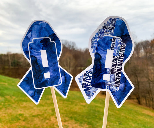 The word cloud and watercolor designs are shown on 2 sticks. Both ribbons feature a dark blue color awareness ribbon with a critically low battery, battery with an exclamation point, in the center. The word cloud design on the left is split in half with a word cloud on the left half of the ribbon and right half of the battery.