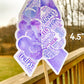 A close up of the 4.5 in word cloud ribbon is shown. You can see the words clearly in matching shades of purple. The words are things like Epilepsy, Myoclonic, Sudden, Seizures, Helpless, Fit, Tender, Dizzy, Aura, Loss of control, Headache, Triggers, status, and more.