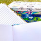 Open blank and lined books are shown next to a stack of books with patterned covers.