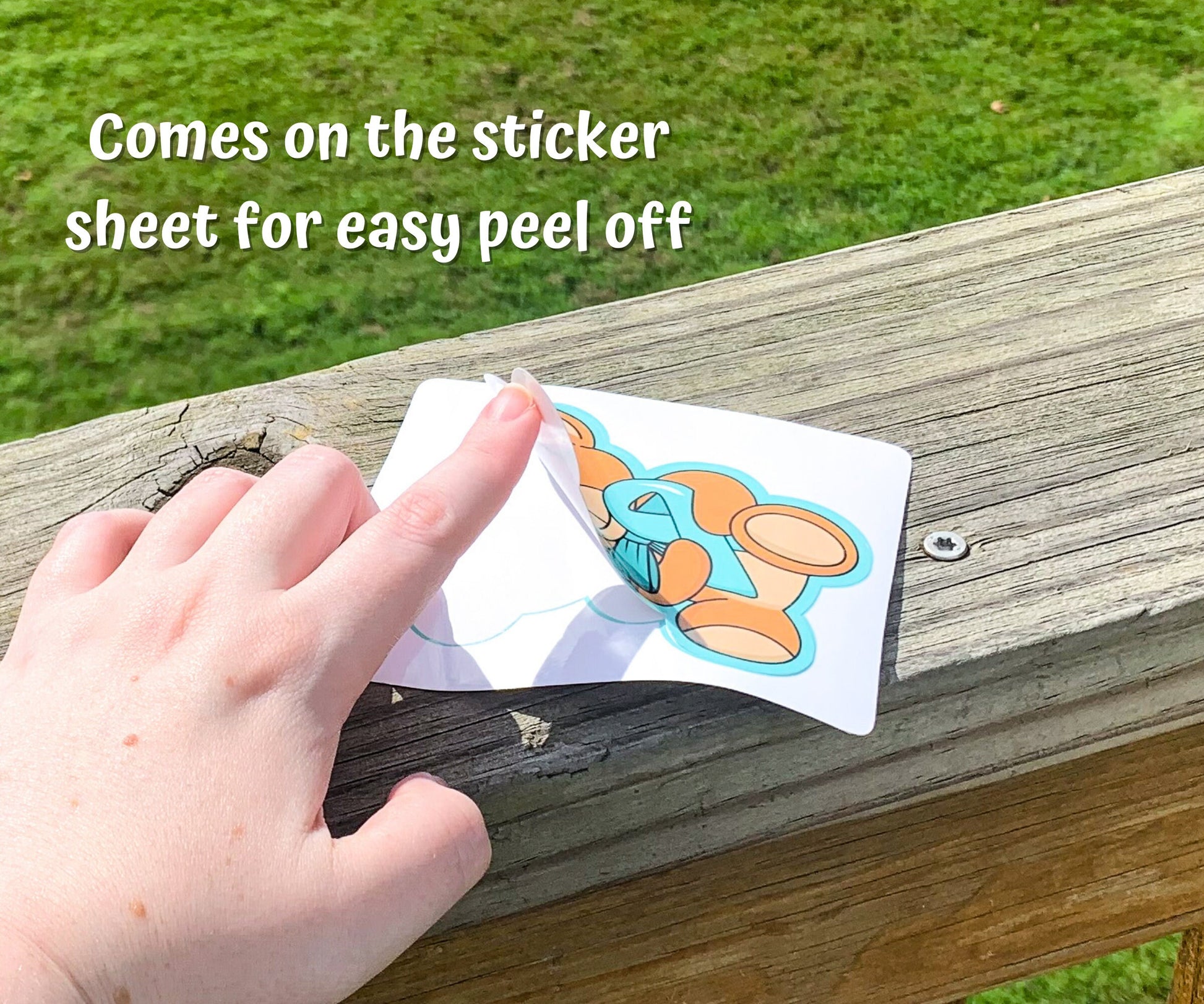 A hand is shown peeling the turquoise bear sticker off a sticker sheet. A note says comes on the sticker sheet for easy peel off